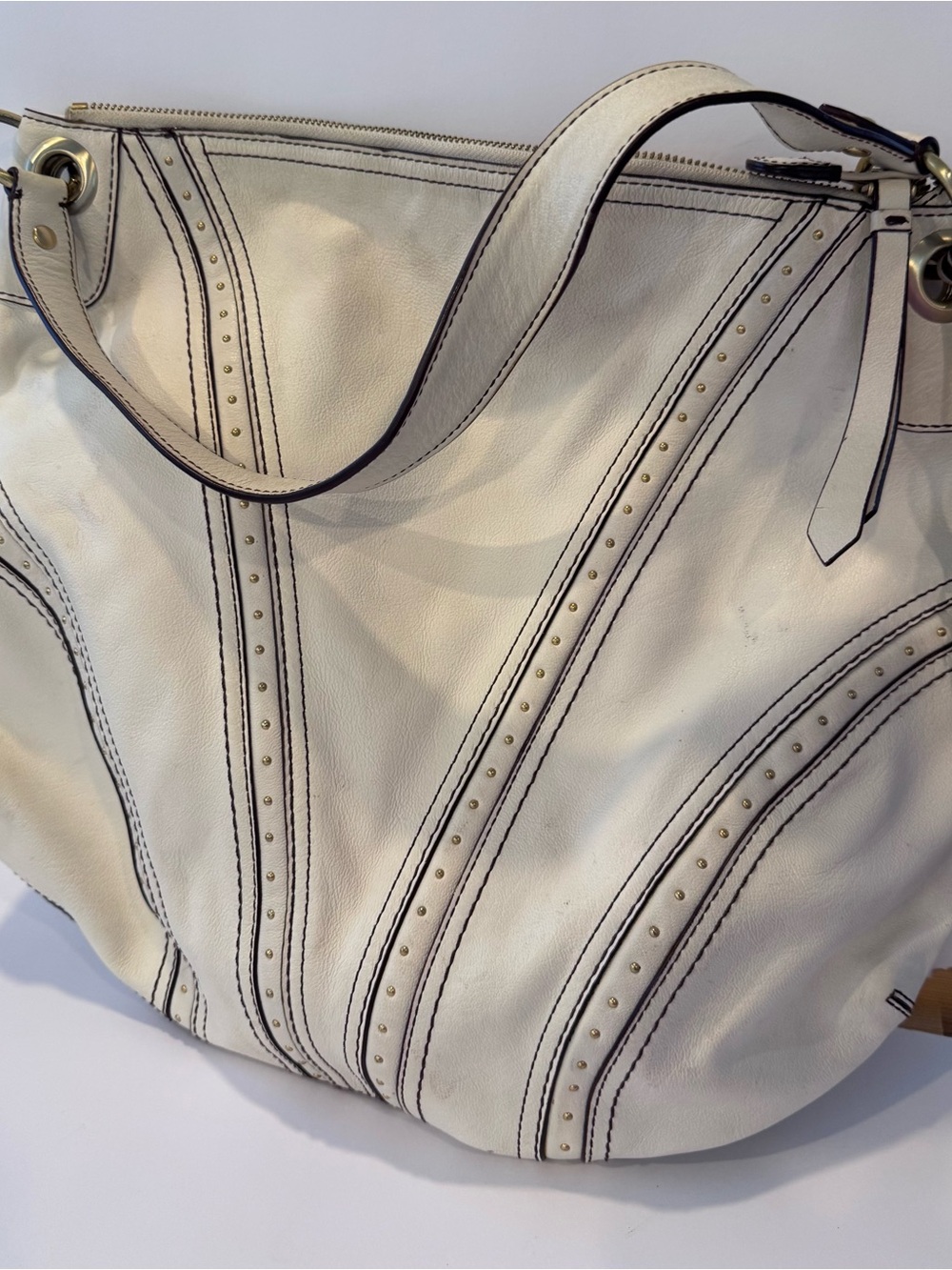Off White Studded Leather Shoulder Bag
Cole haan